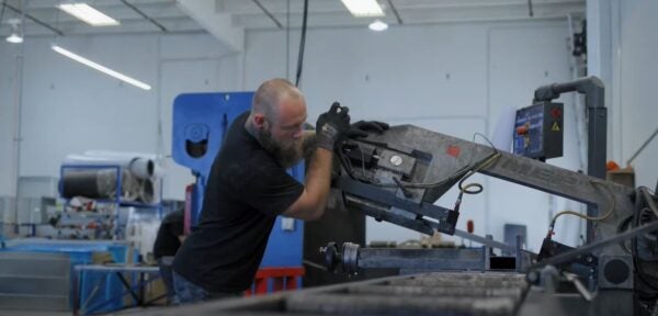 Johansen Mechanical and Coastal Community Bank YouTube Video Screengrab of manning working in metal shop