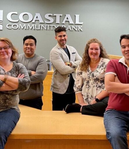 Coastal Community Bank employees posing