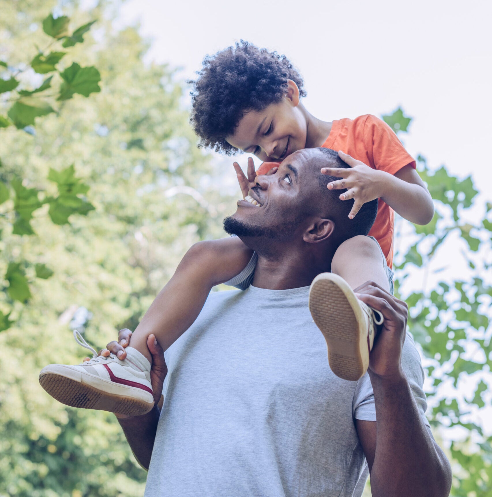 Happy father and son on walk thankful for their hassle free banking options