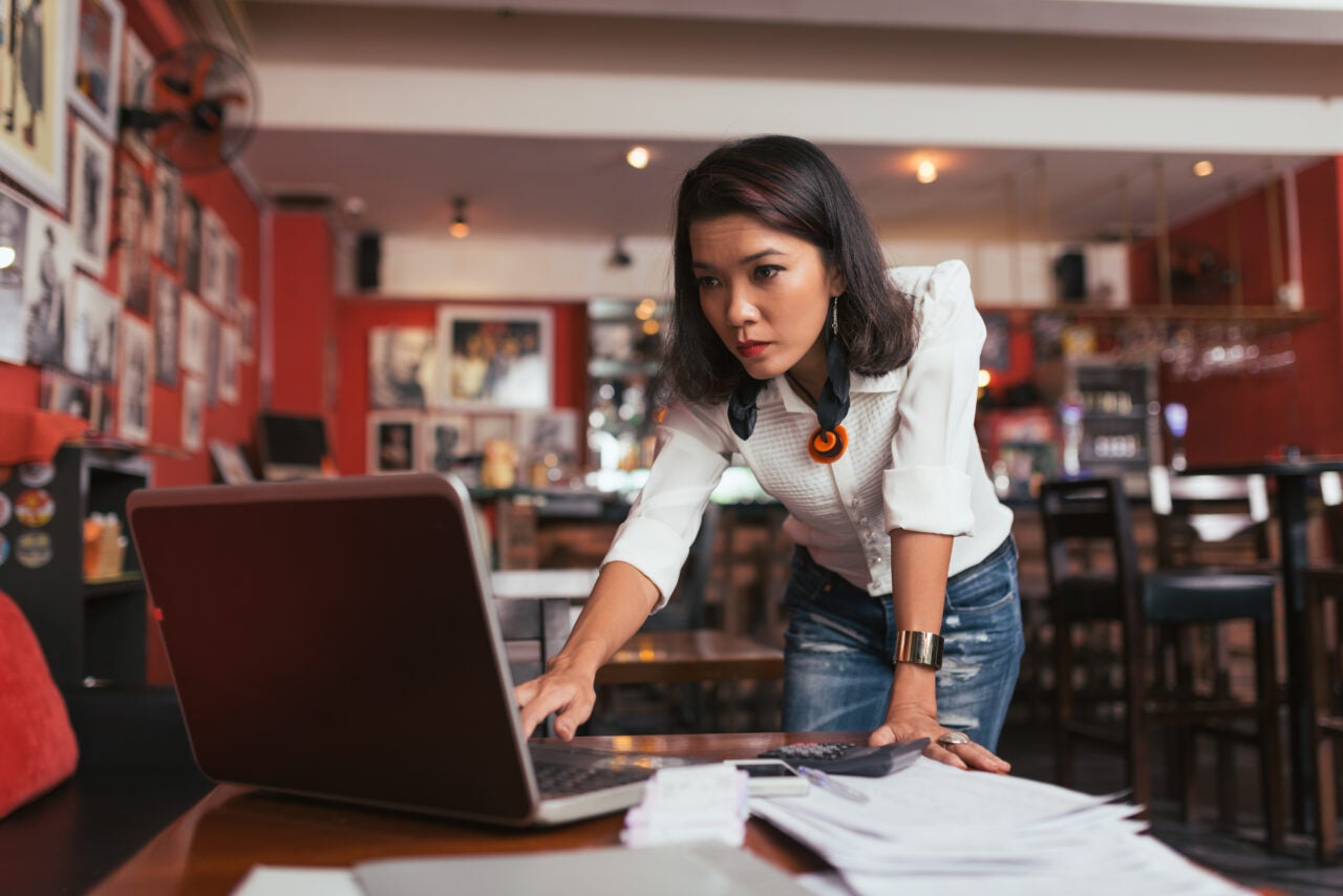Woman checking her insured cash sweep account online